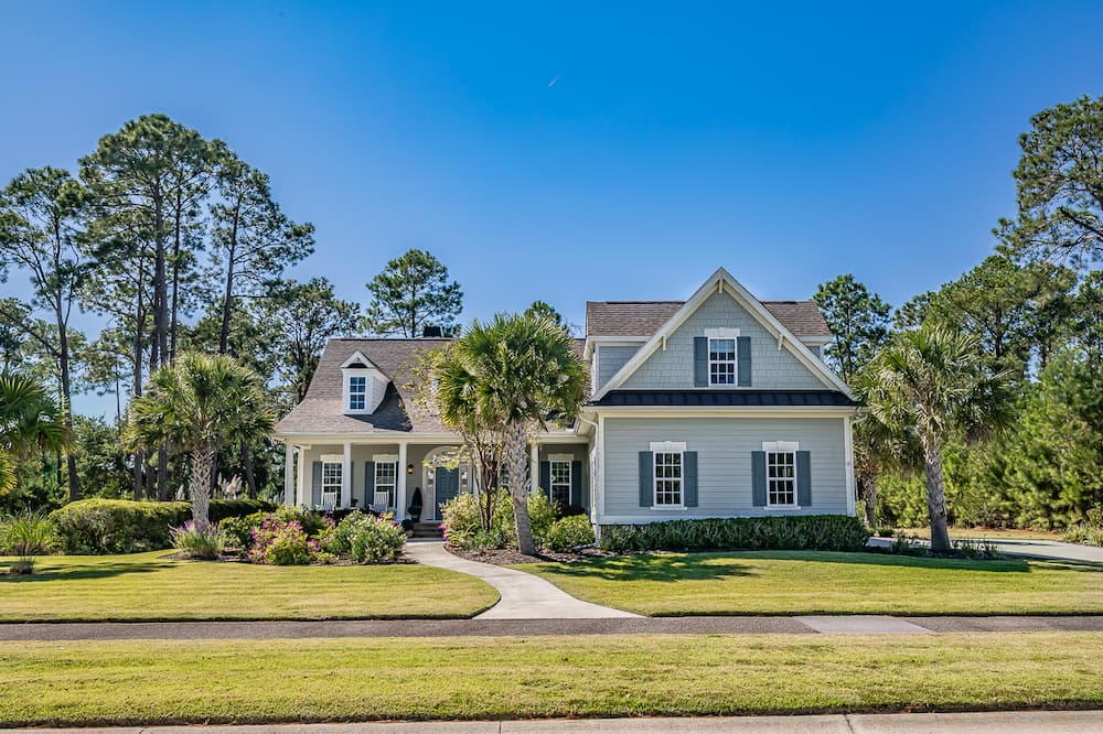 Front facing view of teal family house