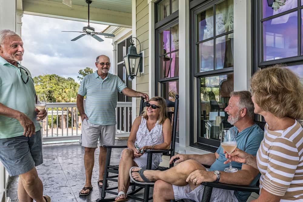 Family having a good time talking on the patio